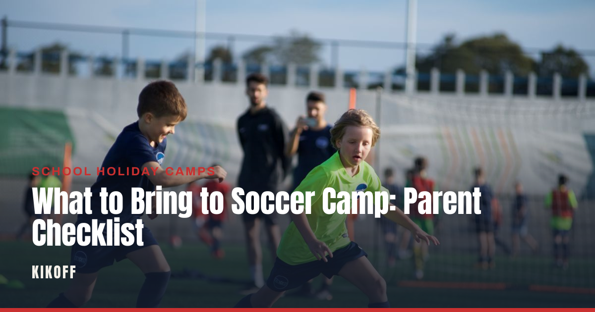A packed kids' sports bag with boots, shin pads and a water bottle laid out on grass before soccer camp.