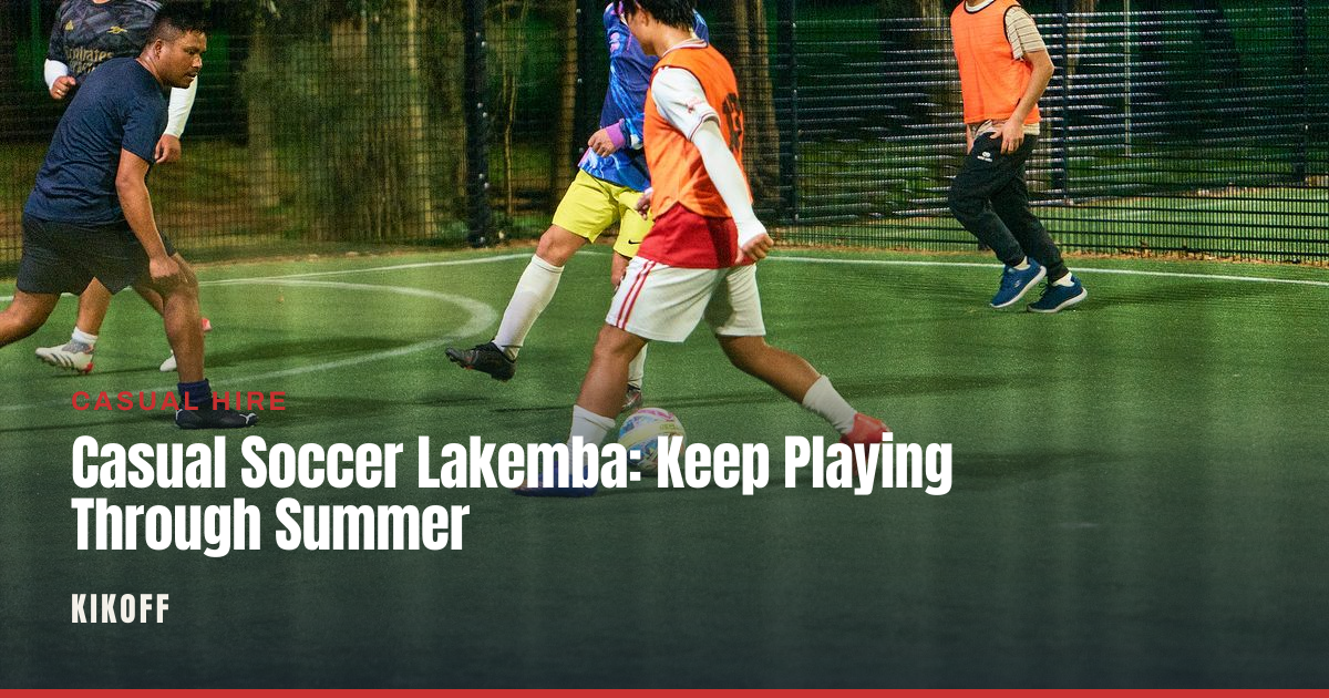 Players in a caged 5-a-side match under lights at a Lakemba football pitch.