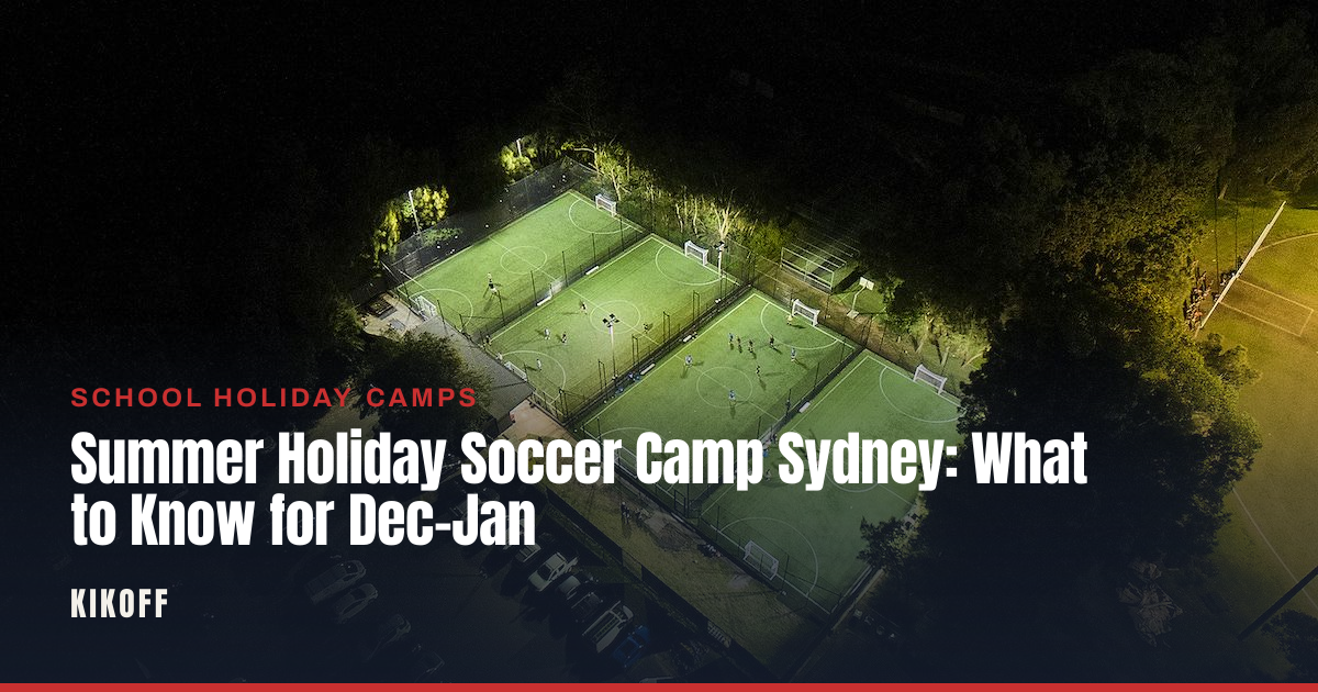 Kids running drills on a floodlit caged pitch during a morning school holiday soccer session